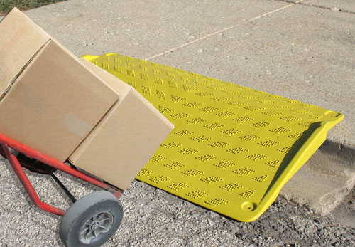SafeKerb Curb Ramp with Loaded Hand Truck on top